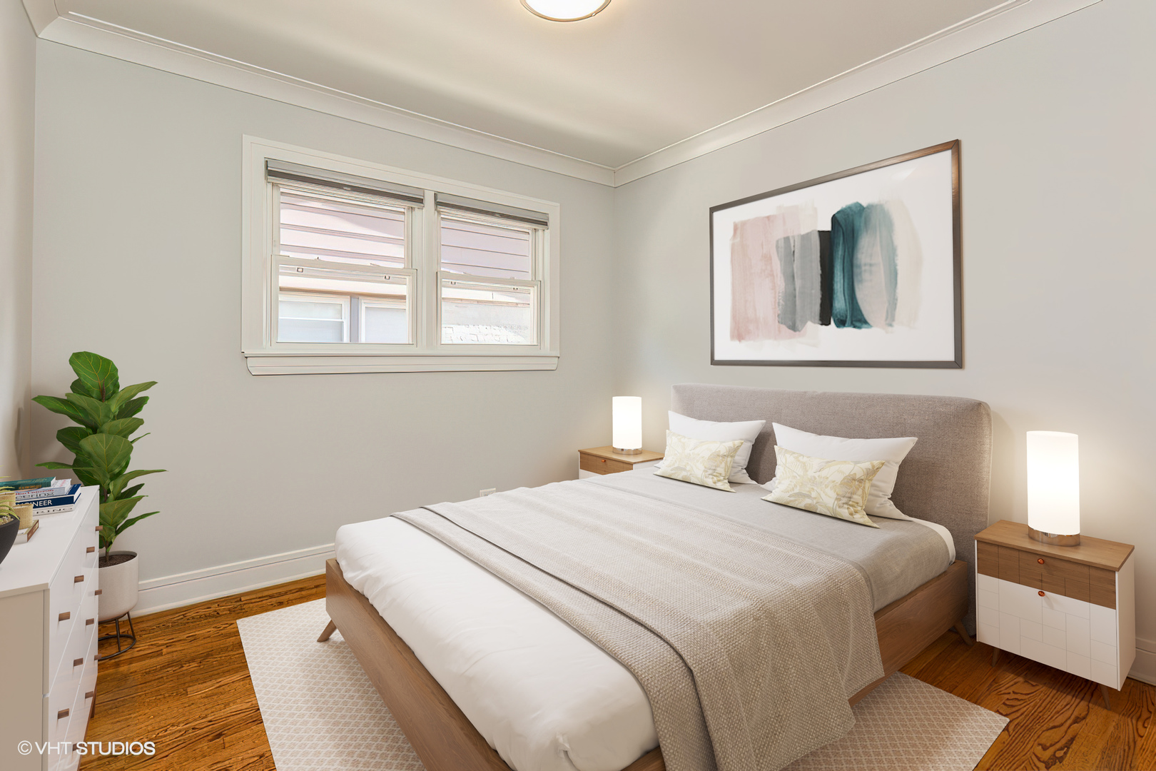 4150 Main Street Skokie, IL 60076 - Photo 14 of 28 a bedroom with a bed and a potted plant