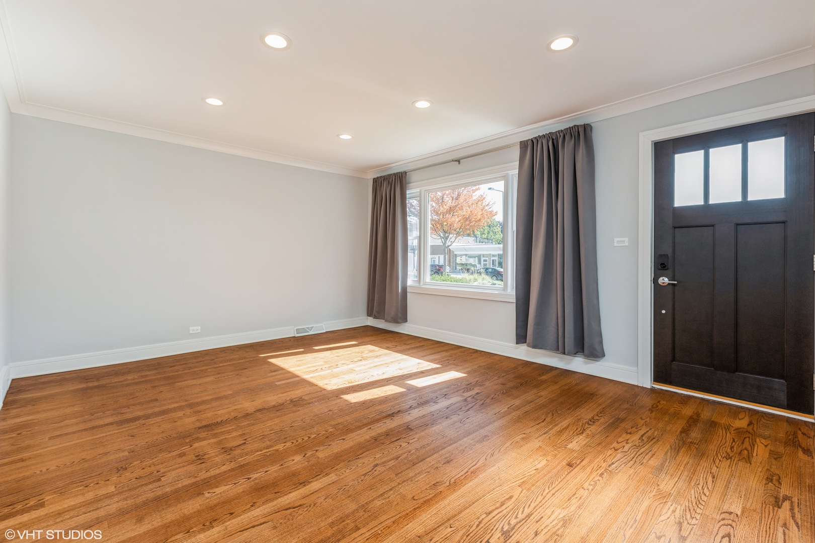 4150 Main Street Skokie, IL 60076 - Photo 2 of 28 a view of empty room with wooden floor and fan