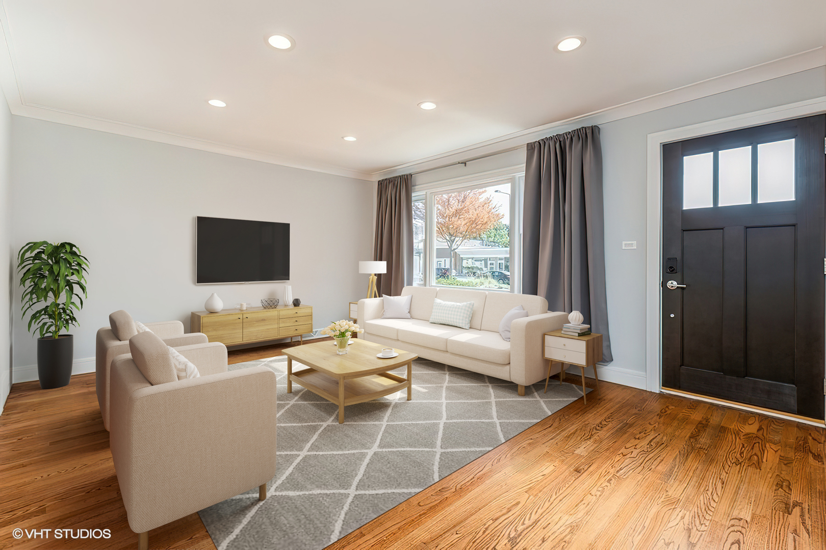 4150 Main Street Skokie, IL 60076 - Photo 3 of 28 a living room with furniture and a flat screen tv