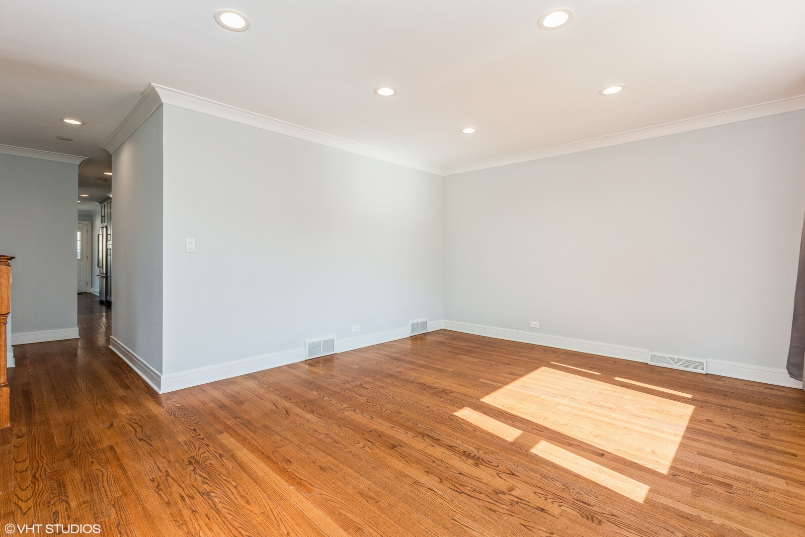 4150 Main Street Skokie, IL 60076 - Photo 4 of 28 an empty room with wooden floor and entrance
