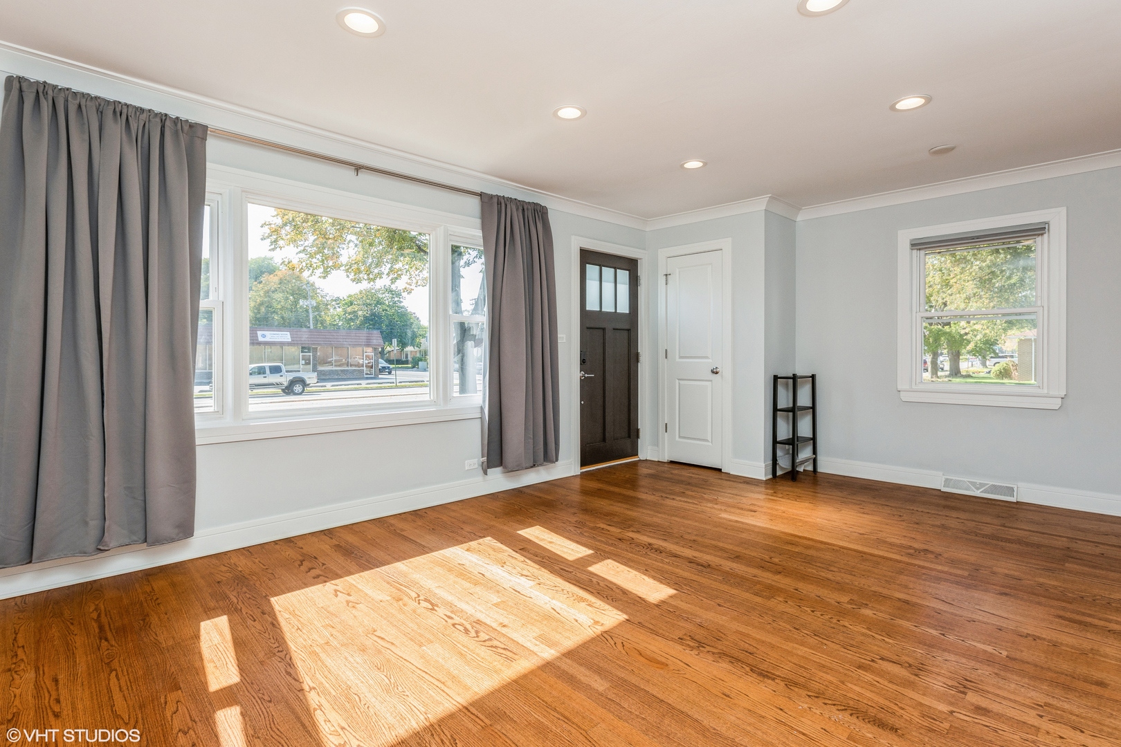 4150 Main Street Skokie, IL 60076 - Photo 6 of 28 a view of an empty room with window and wooden floor