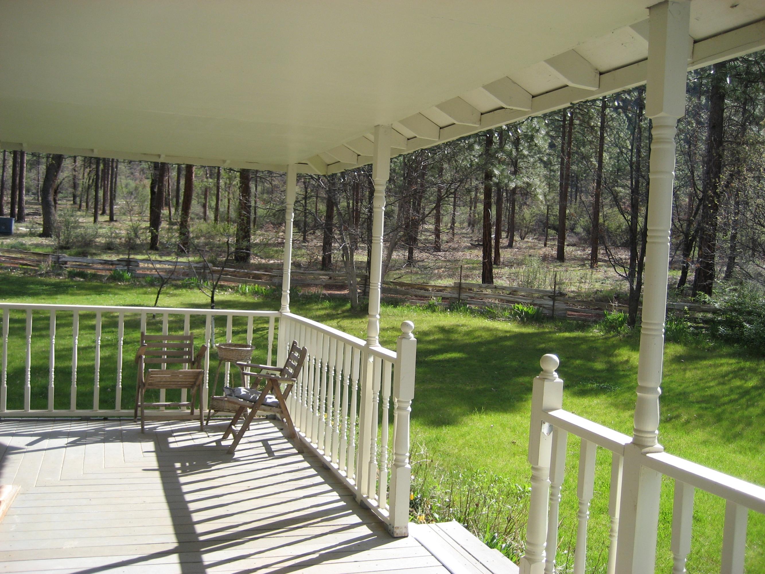 30204 Day Road McArthur, CA 96056 - Photo 3 of 25 a view of a deck with a floor to ceiling window and wooden fence
