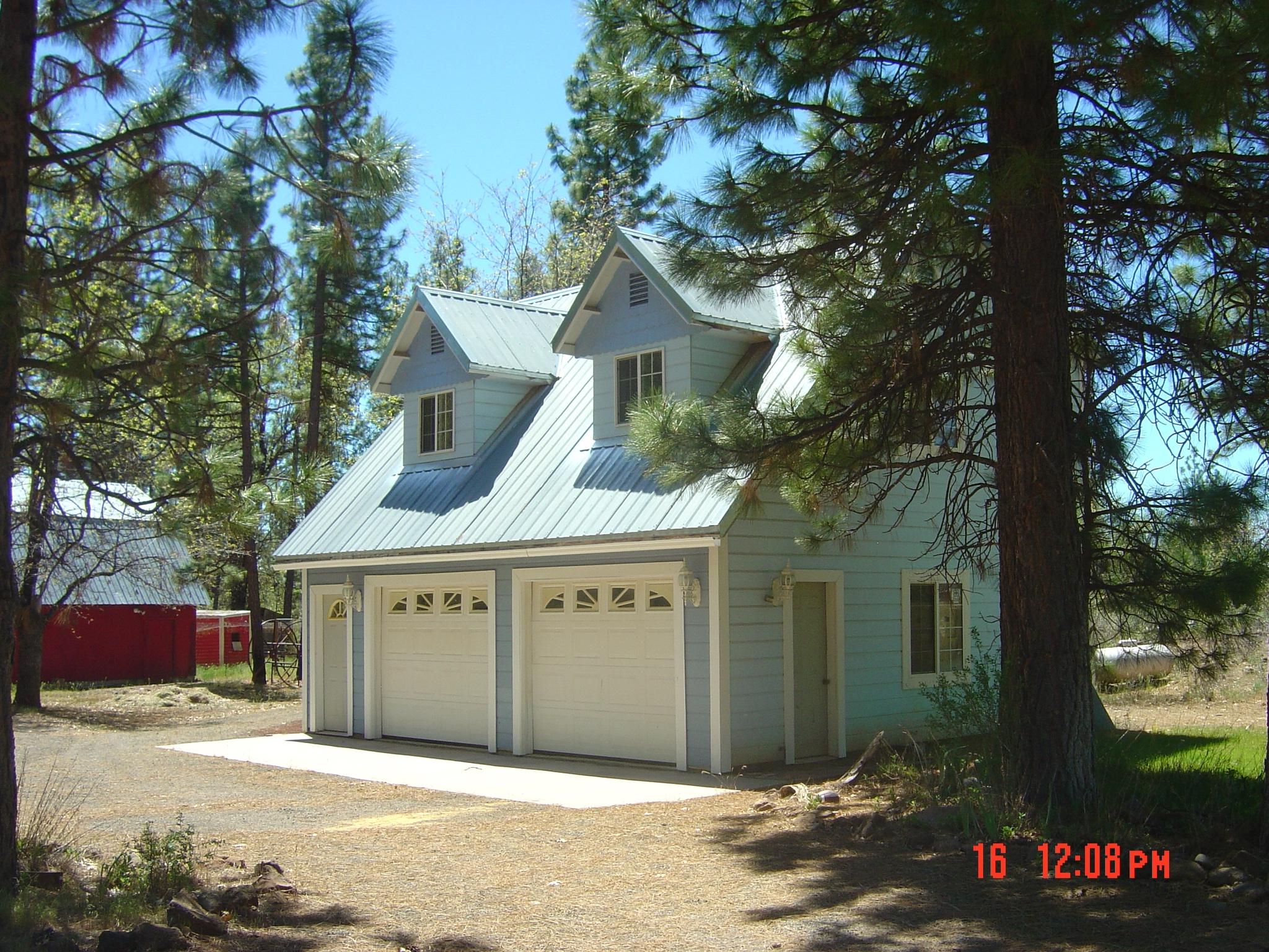 30204 Day Road McArthur, CA 96056 - Photo 4 of 25 a front view of a house with a garden