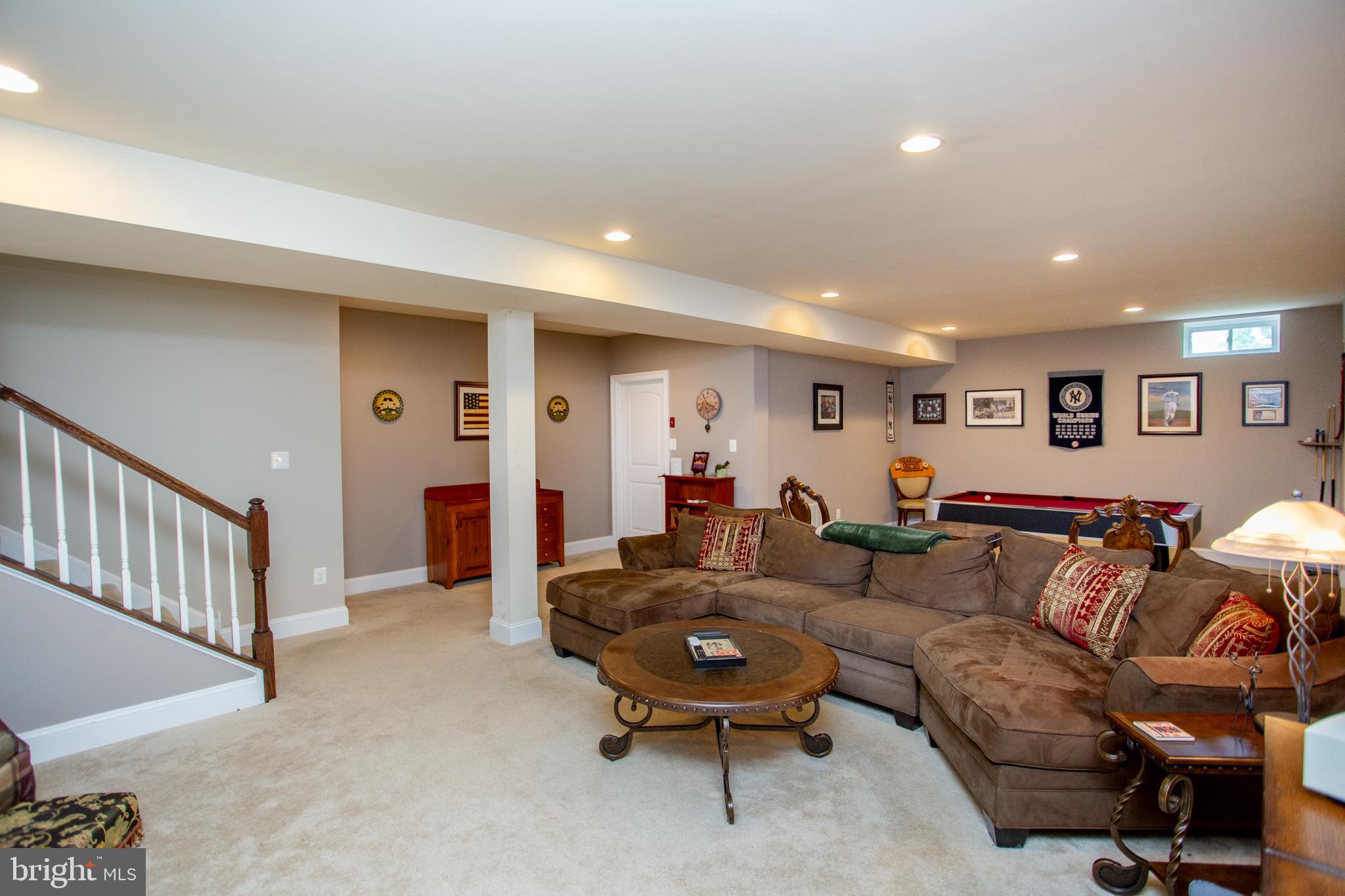 4682 Plough Tavern Road Doylestown, PA 18902 - Photo 33 of 42 a living room with furniture and a wooden floor