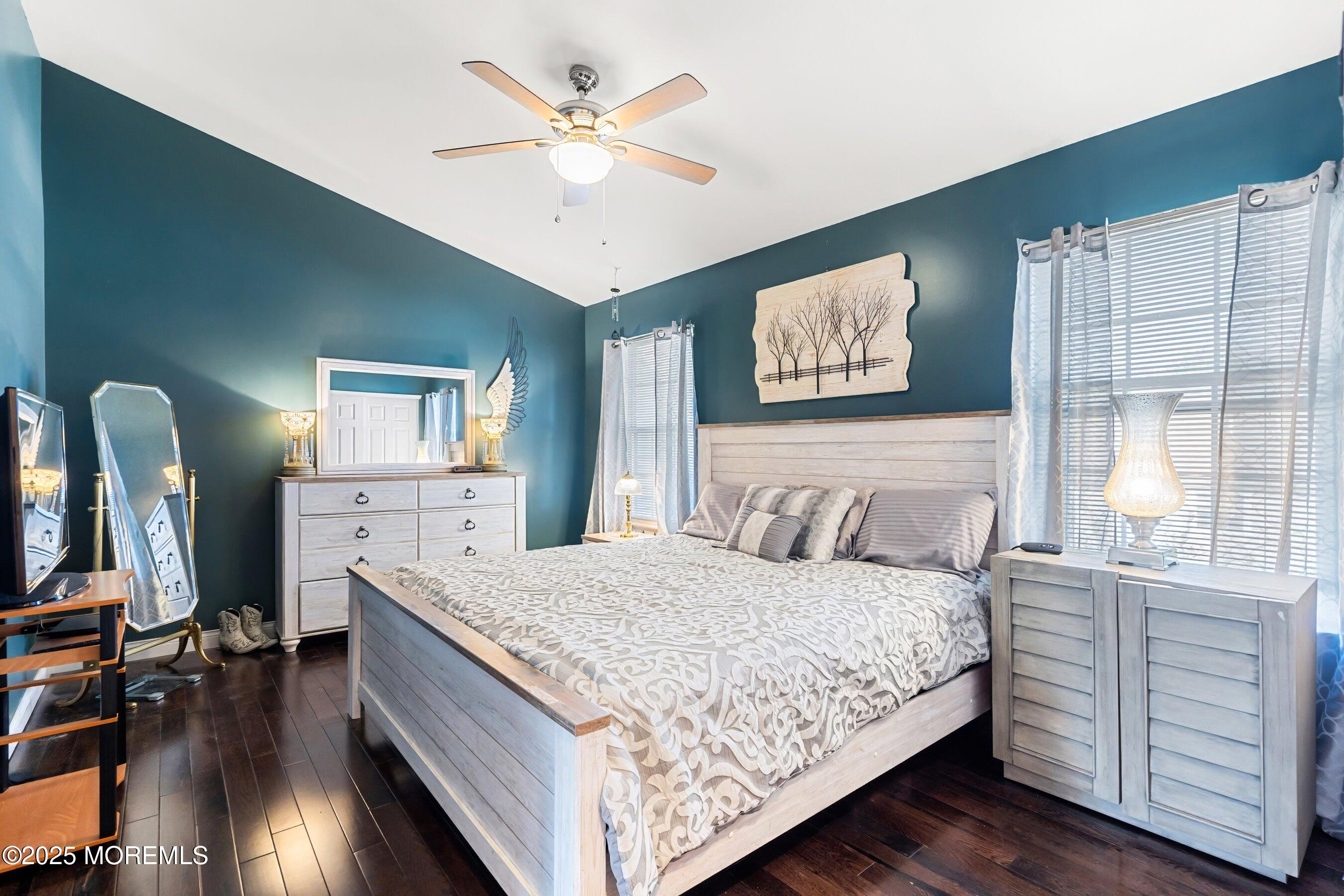 59 Perri Road Freehold, NJ 07728 - Photo 20 of 36 a bedroom with a large bed and a chandelier