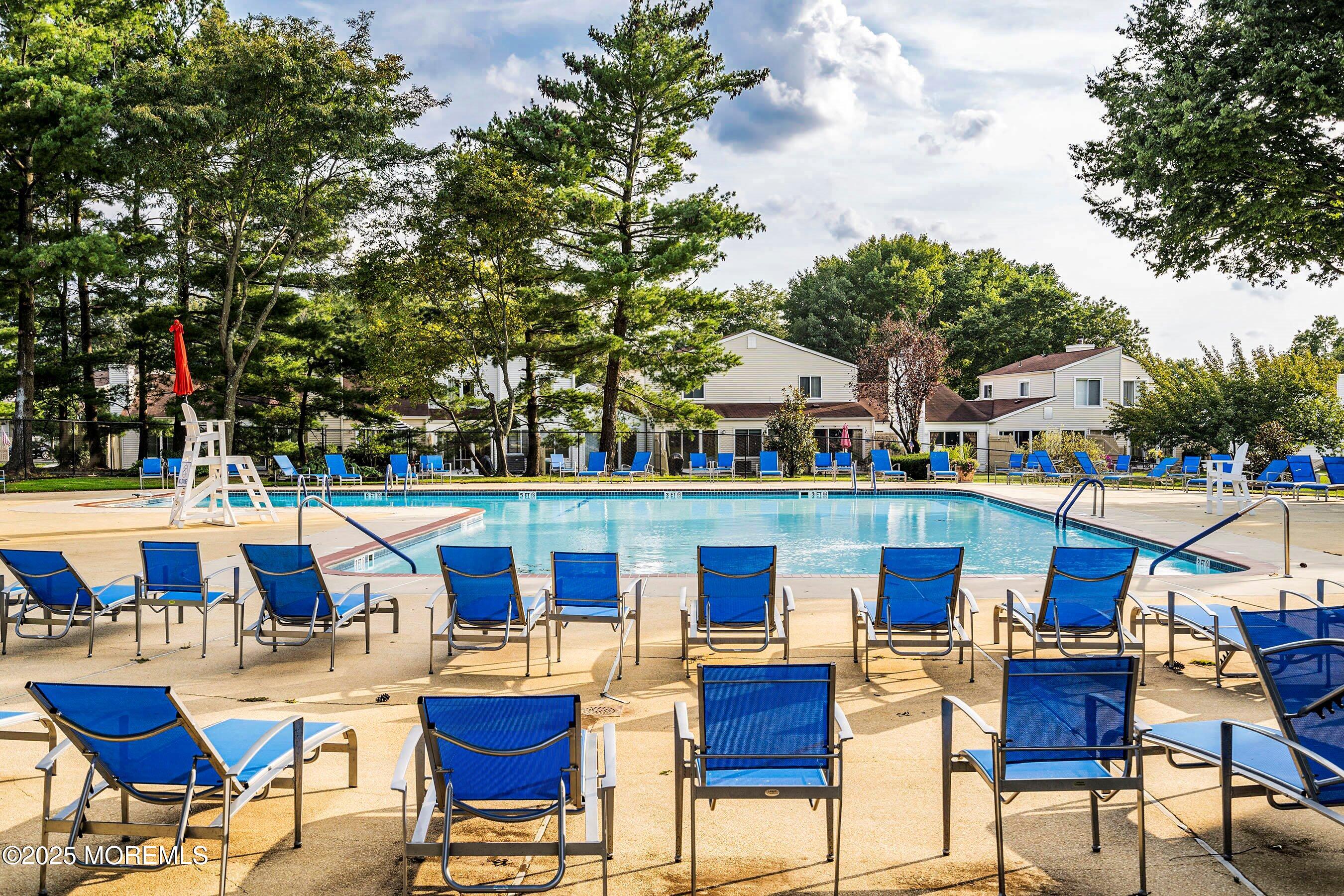 59 Perri Road Freehold, NJ 07728 - Photo 31 of 36 a view of an chairs and tables in the patio