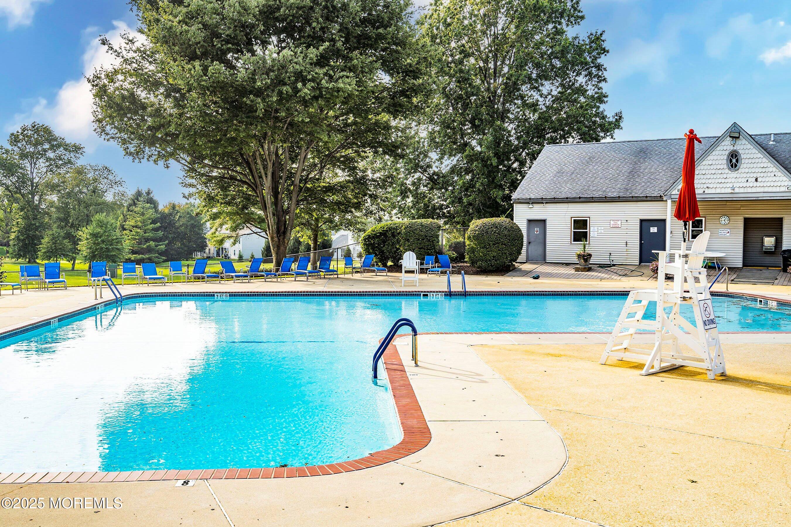 59 Perri Road Freehold, NJ 07728 - Photo 32 of 36 a view of a swimming pool with lounge chairs
