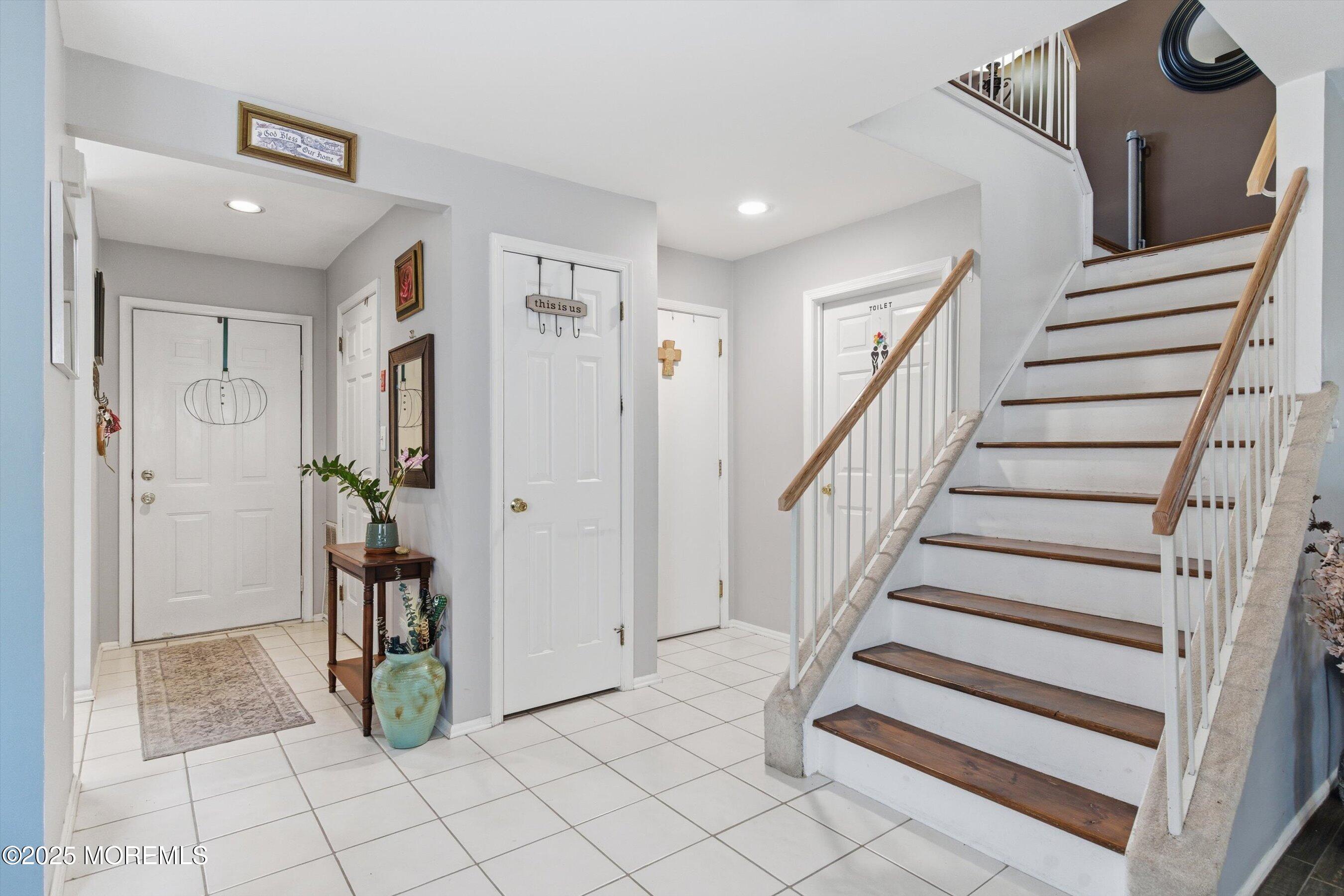 59 Perri Road Freehold, NJ 07728 - Photo 5 of 36 a view of entryway and hall with a rug