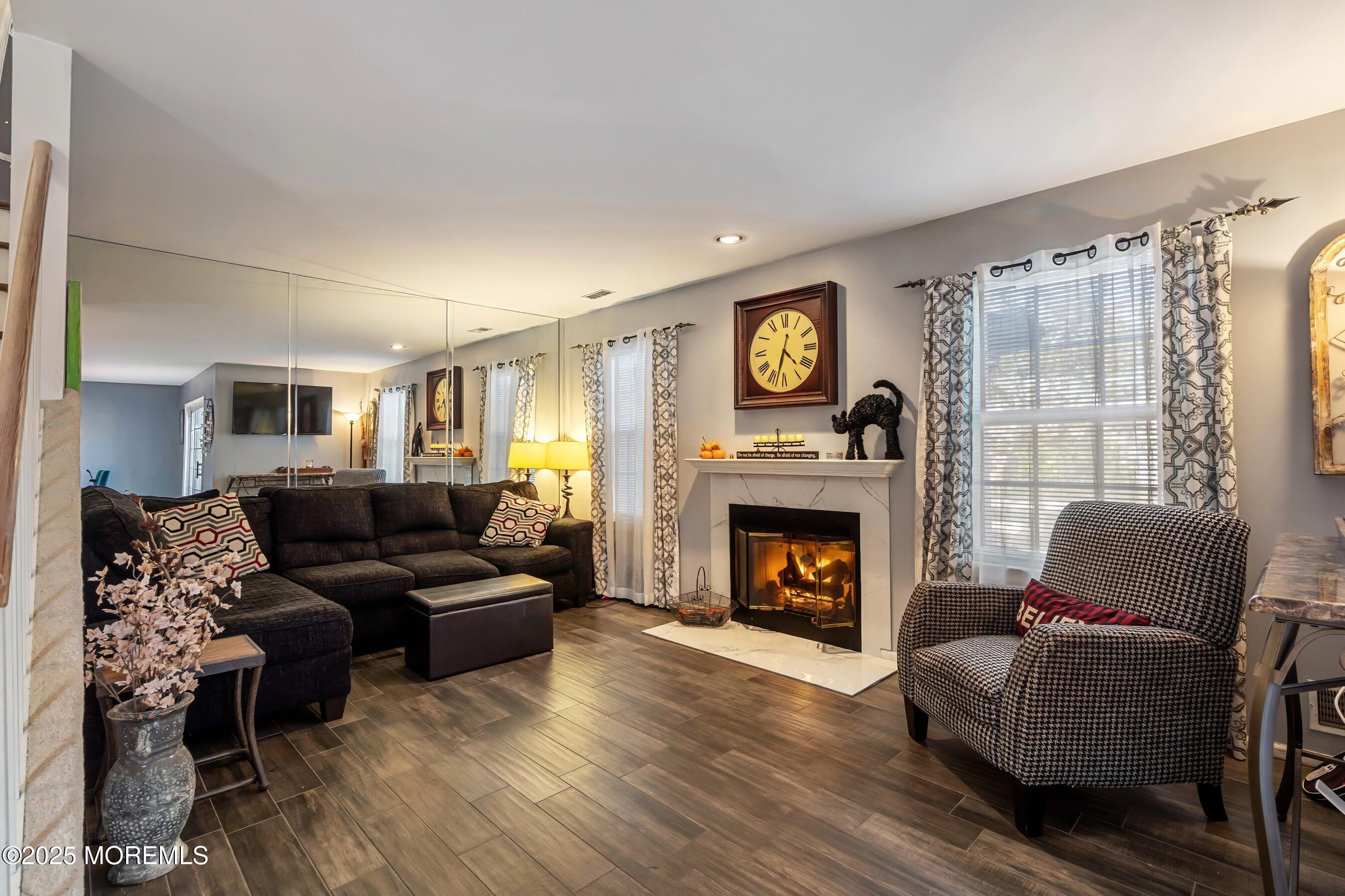 59 Perri Road Freehold, NJ 07728 - Photo 7 of 36 a living room with furniture and a fireplace