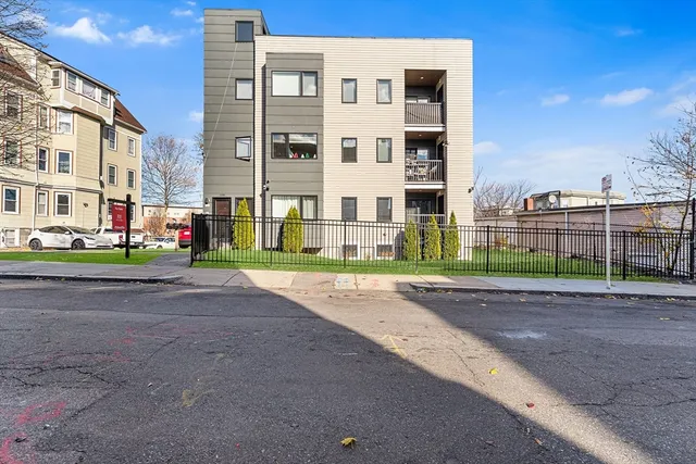 a view of a street with a building in front of it