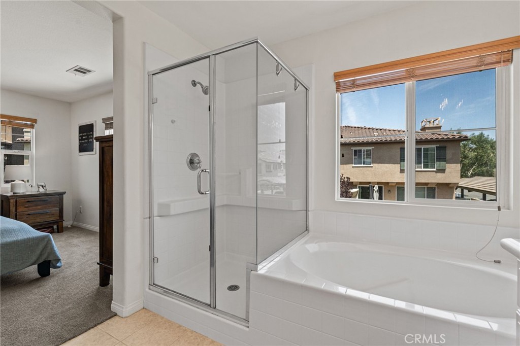 28356 Santa Rosa Lane Saugus, CA 91350 - Photo 14 of 50 a bathroom with a bathtub and a shower