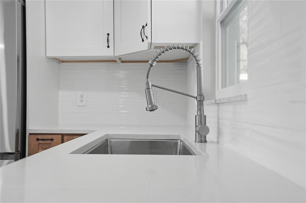 5543 Quist Drive Port Richey, FL 34668 - Photo 7 of 29 a utility room with a sink