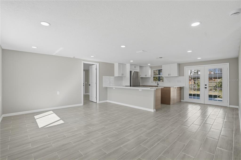 5543 Quist Drive Port Richey, FL 34668 - Photo 9 of 29 a view of kitchen with wooden floor and electronic appliances