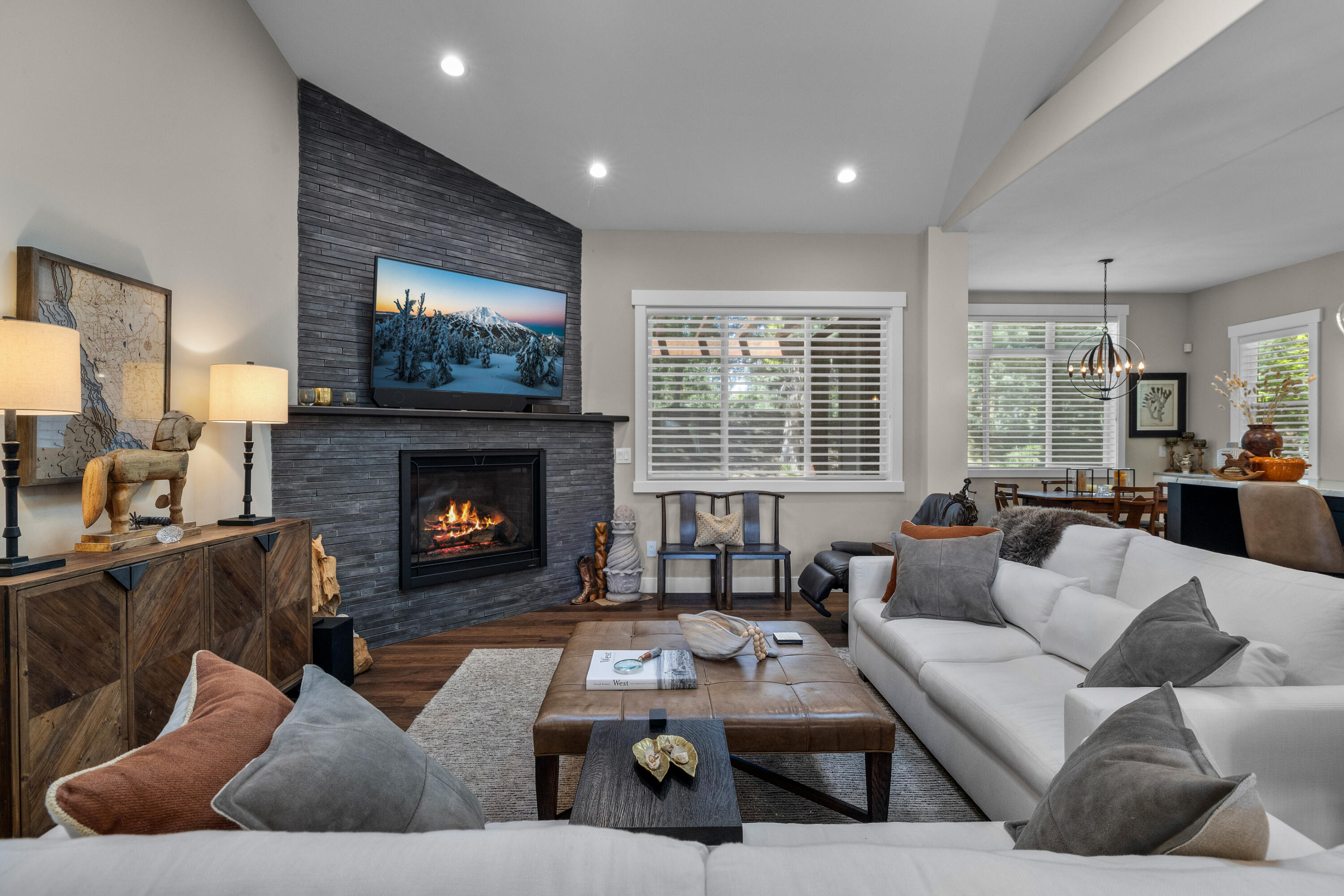 19460 Chip Shot Lane Bend, OR 97702 - Photo 8 of 56 a living room with furniture and a fireplace