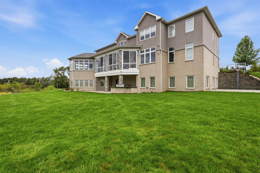 931 Pleasant Hill Road Wexford, PA 15090 - Photo 6 of 50 a front view of a house with a garden and yard