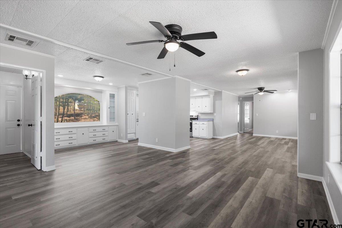 18607-c R 498 C R 498 Lindale, TX 75771 - Photo 14 of 41 a view of empty room with wooden floor and ceiling fan
