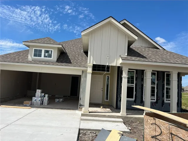 a front view of a house with glass windows