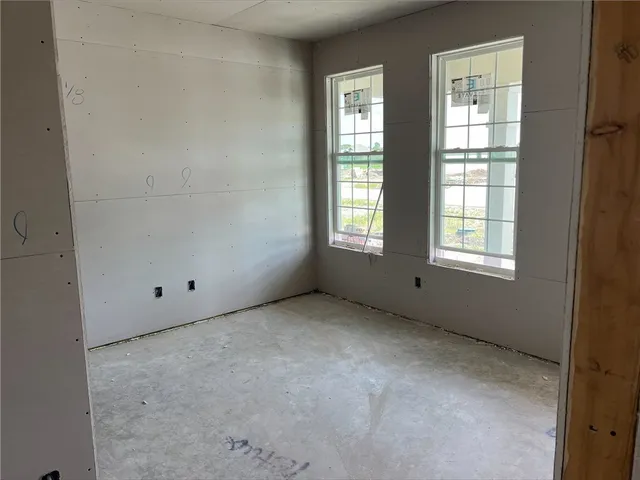 an empty room with windows