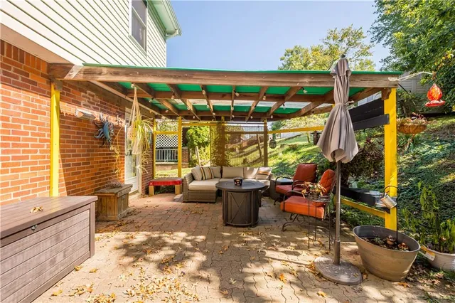 a view of a patio with table and chairs and potted plants