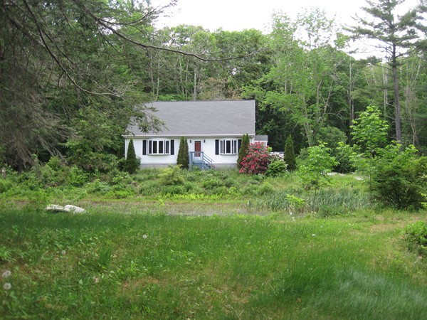 115 Baker Pond Road Dudley, MA 01571 - Photo 1 of 17 a view of a house with a yard