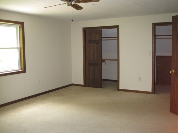 115 Baker Pond Road Dudley, MA 01571 - Photo 12 of 17 an empty room with windows