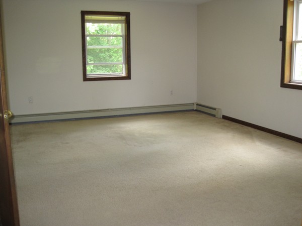 115 Baker Pond Road Dudley, MA 01571 - Photo 13 of 17 an empty room with a window