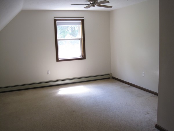 115 Baker Pond Road Dudley, MA 01571 - Photo 14 of 17 a view of a small space with wooden floor and a window