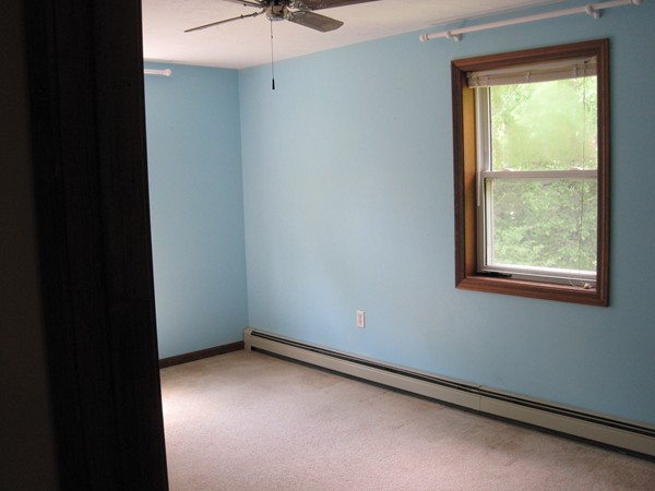 115 Baker Pond Road Dudley, MA 01571 - Photo 15 of 17 an empty room with a window