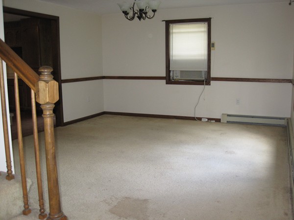 115 Baker Pond Road Dudley, MA 01571 - Photo 6 of 17 a view of an empty room with a window