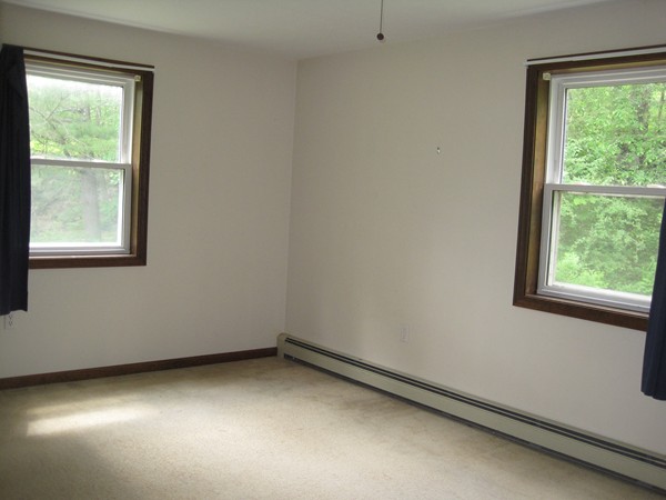 115 Baker Pond Road Dudley, MA 01571 - Photo 10 of 17 a view of a room that has a window