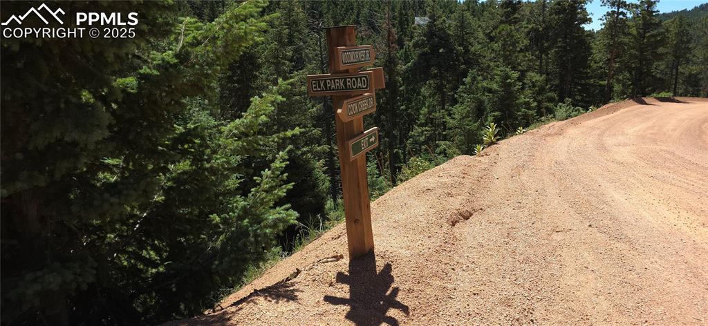 2255 Elk Park Road Larkspur, CO 80118 - Photo 12 of 15 a view of a yard with plants