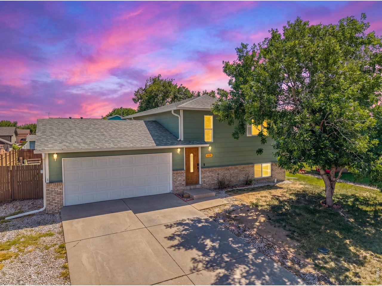 526 East 23rd Street Road Greeley, CO 80631 - Photo 1 of 20 a front view of a house with a yard