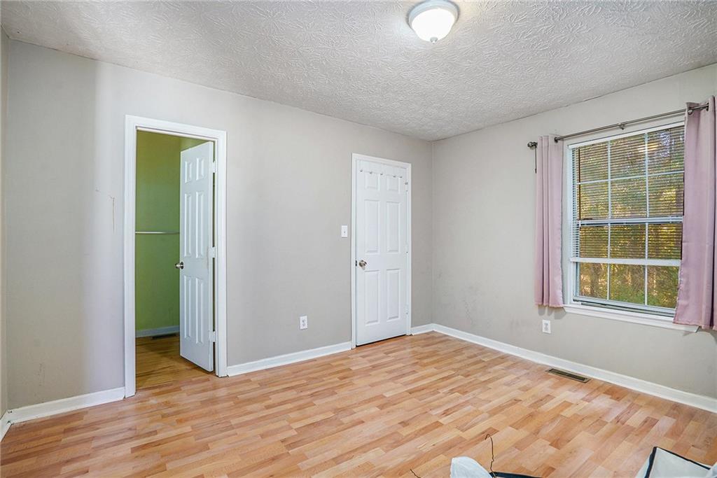 3201 Kingswood Place Decatur, GA 30034 - Photo 14 of 22 a view of empty room with wooden floor and fan