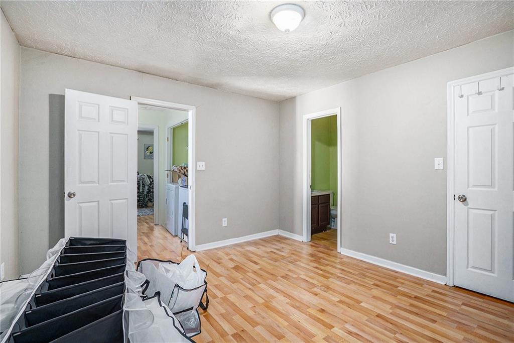 3201 Kingswood Place Decatur, GA 30034 - Photo 15 of 22 a bedroom with a bed and a ceiling fan