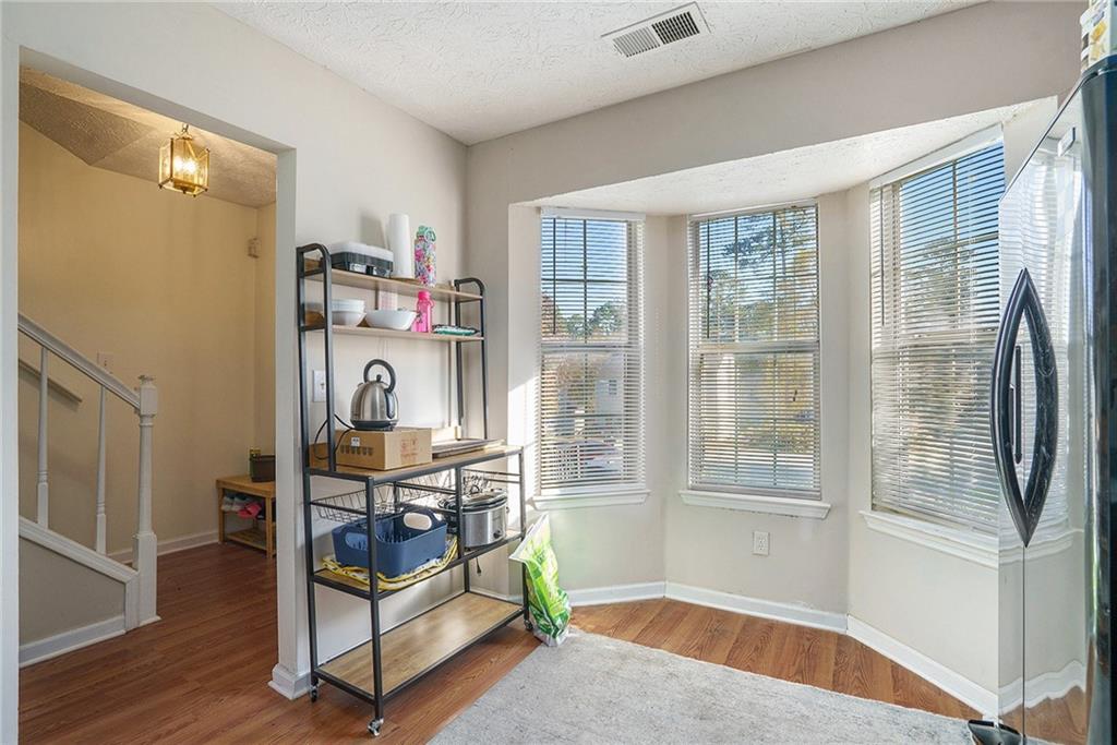 3201 Kingswood Place Decatur, GA 30034 - Photo 5 of 22 a view of an empty room with window and hardwood floor