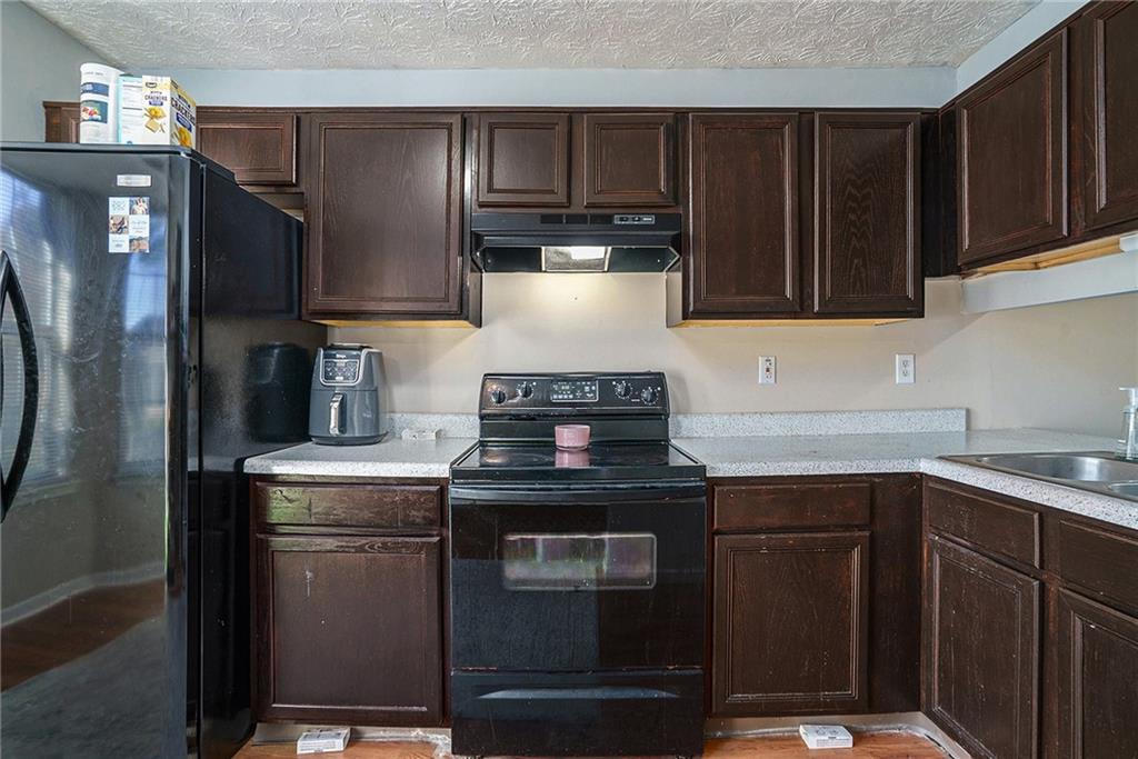 3201 Kingswood Place Decatur, GA 30034 - Photo 7 of 22 a kitchen with a sink stove and refrigerator