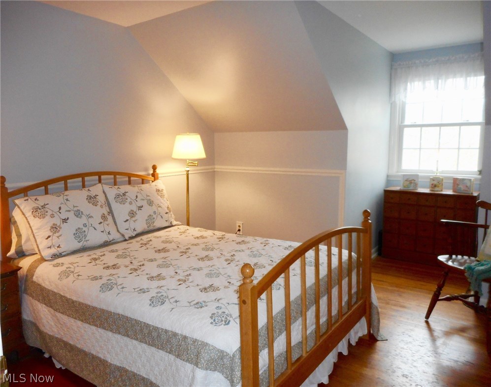 856 Old Spring Road Akron, OH 44321 - Photo 16 of 30 Dormer ceilings adds charm to the bedrooms. This bedroom has hardwood floors and chair rail