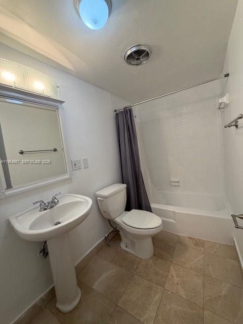 9159 Southwest 77th Avenue, Unit 409 Miami, FL 33156 - Photo 15 of 29 a bathroom with a sink toilet and shower