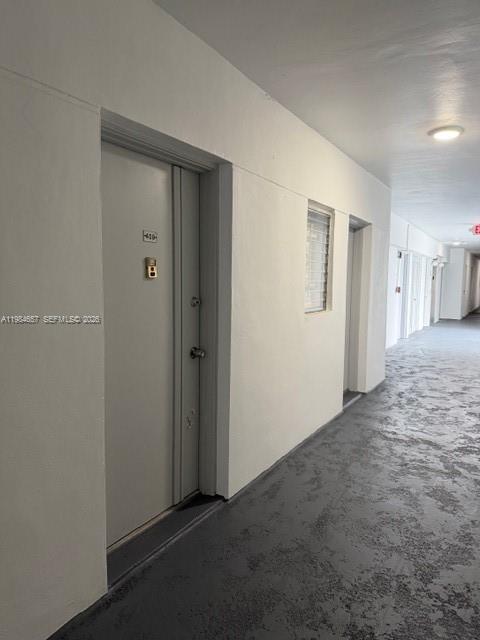 9159 Southwest 77th Avenue, Unit 409 Miami, FL 33156 - Photo 21 of 29 a view of a room with a hallway