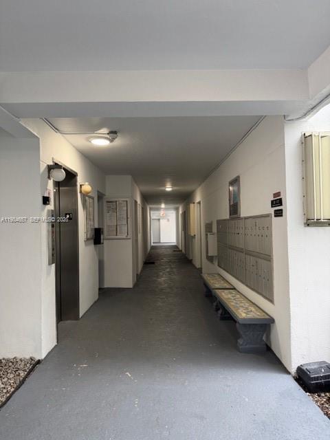 9159 Southwest 77th Avenue, Unit 409 Miami, FL 33156 - Photo 27 of 29 a view of hallway with stairs and windows