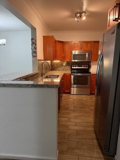 9159 Southwest 77th Avenue, Unit 409 Miami, FL 33156 - Photo 5 of 29 a kitchen with granite countertop a refrigerator and a stove
