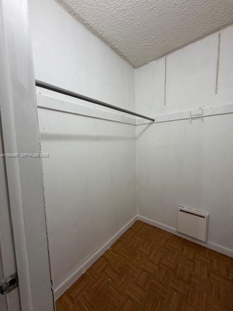 9159 Southwest 77th Avenue, Unit 409 Miami, FL 33156 - Photo 10 of 29 a view of a room with racks on the wall