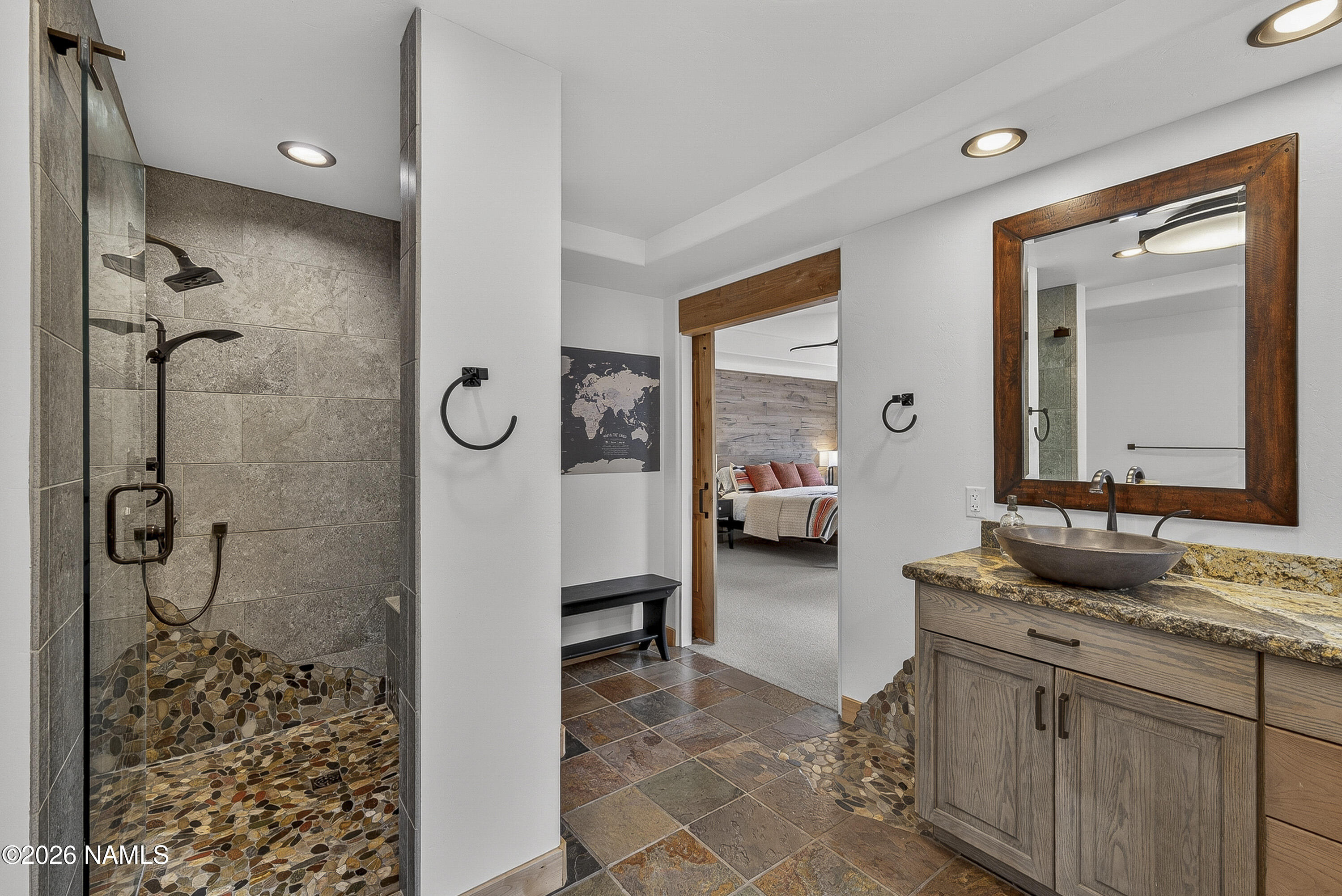 105 West Mt Elden Lookout Road Flagstaff, AZ 86001 - Photo 33 of 54 a en suite bathroom with a double vanity sink a mirror and shower