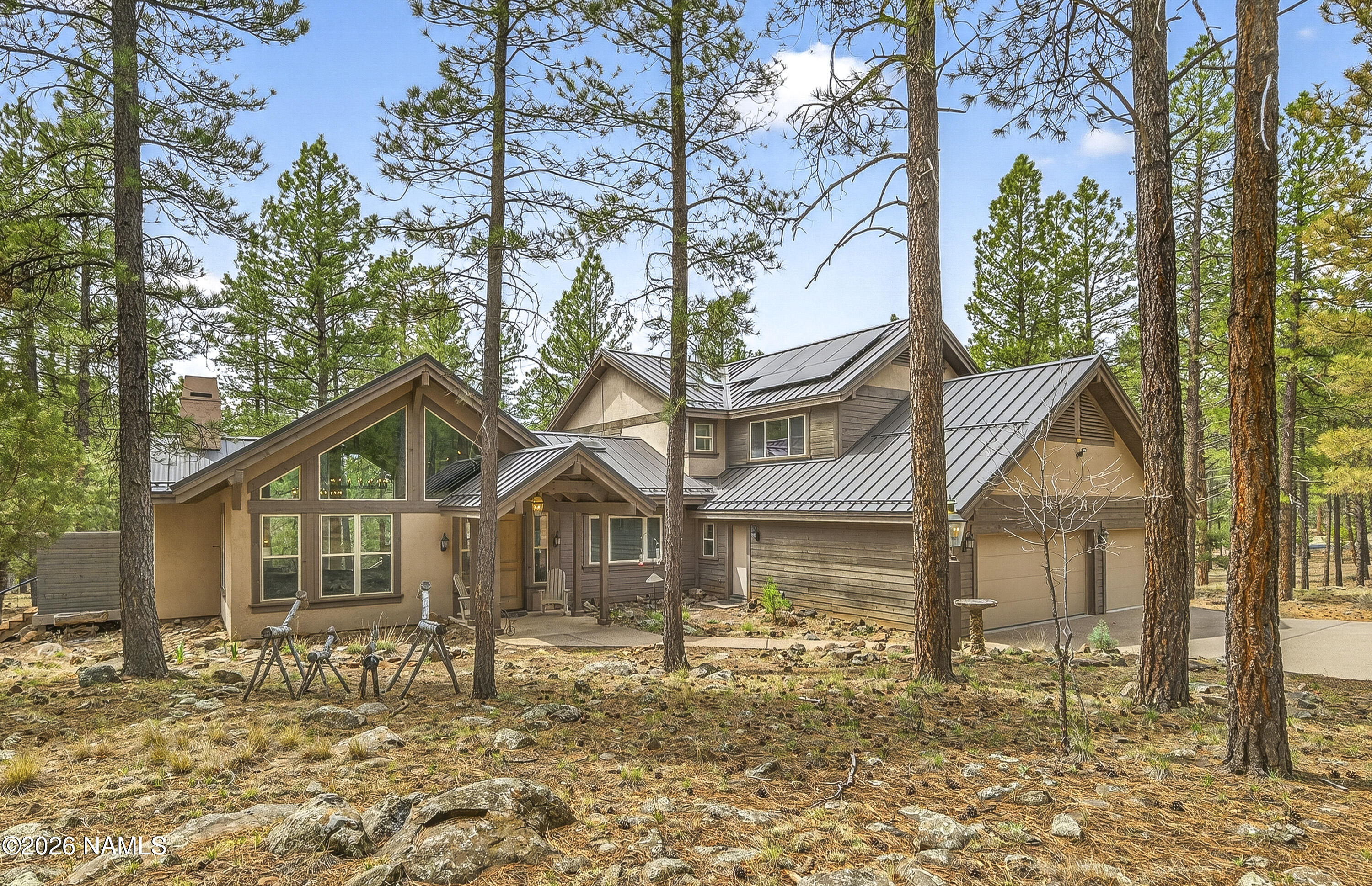105 West Mt Elden Lookout Road Flagstaff, AZ 86001 - Photo 4 of 54 a front view of a house with a yard