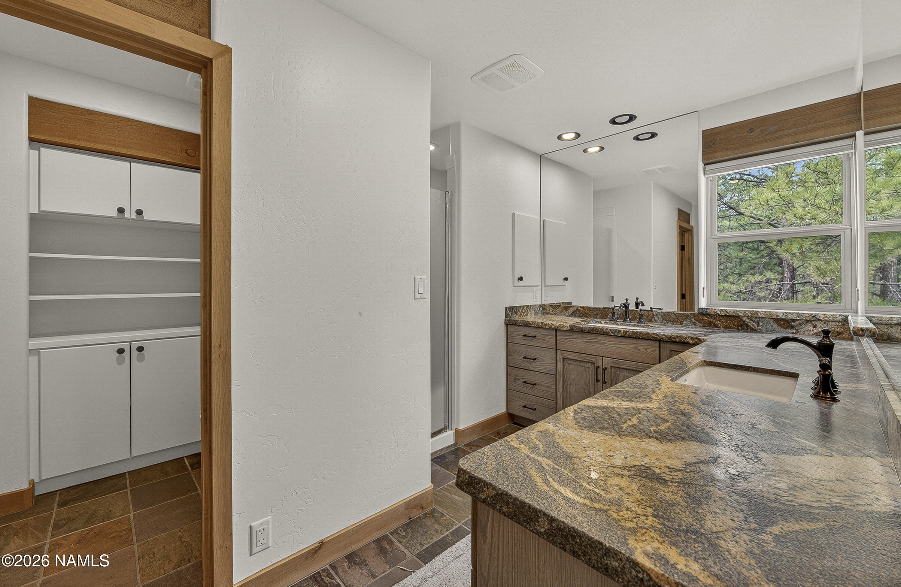 105 West Mt Elden Lookout Road Flagstaff, AZ 86001 - Photo 42 of 54 a kitchen with granite countertop a sink and a stove