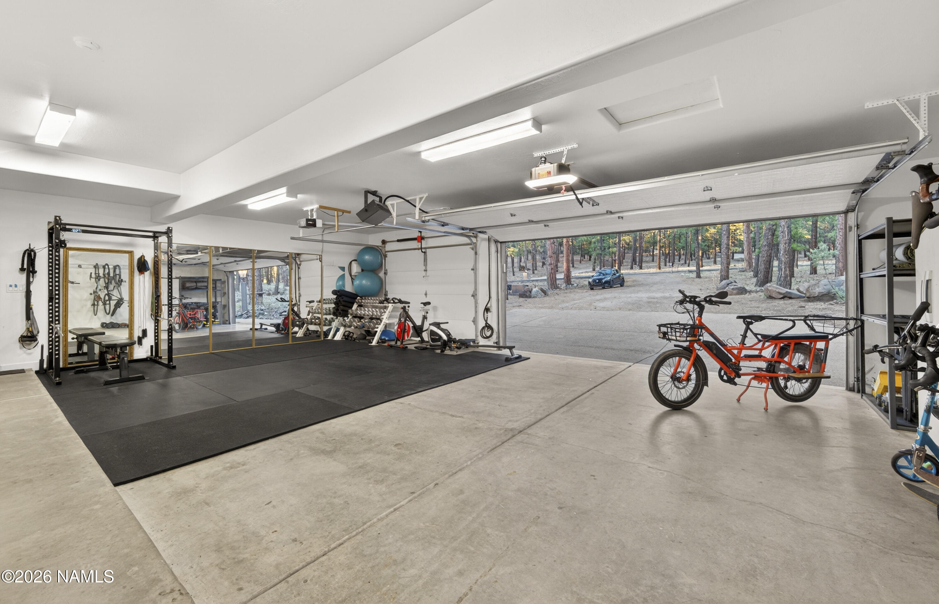 105 West Mt Elden Lookout Road Flagstaff, AZ 86001 - Photo 52 of 54 a view of a garage with a bike and a car