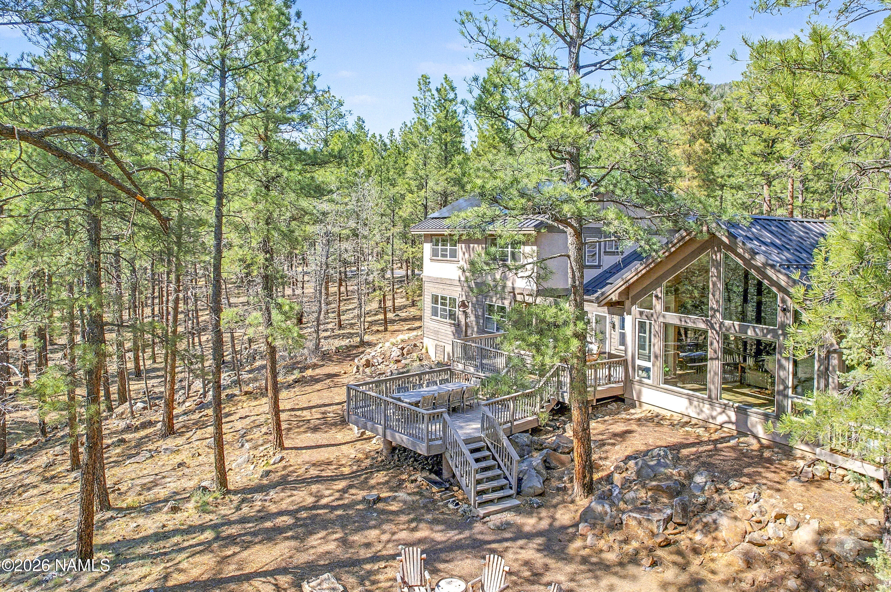 105 West Mt Elden Lookout Road Flagstaff, AZ 86001 - Photo 10 of 54 a view of a house with backyard porch and sitting area