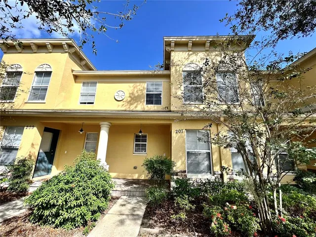 a view of a building with a tree