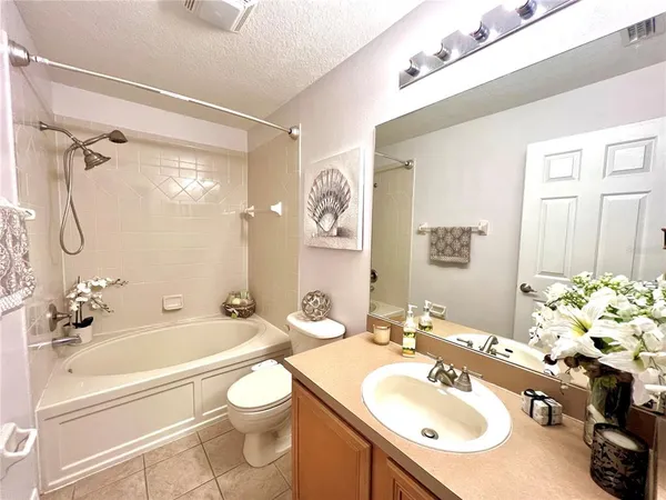 a bathroom with a sink a toilet and a bathtub