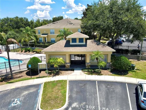 an aerial view of a house with swimming pool